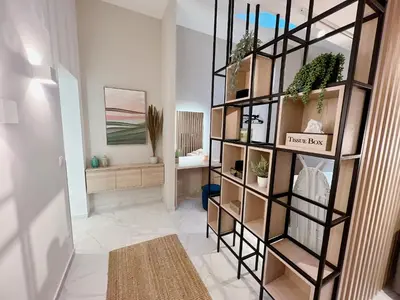 Ein Bett oder Betten in einem Zimmer der Unterkunft Zeus Design Apartmenthaus
