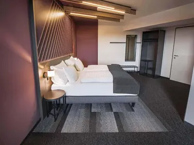Ein Bett oder Betten in einem Zimmer der Unterkunft B&B HOTEL Wiener Neudorf