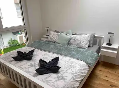 Ein Bett oder Betten in einem Zimmer der Unterkunft Wiener Townhouse Schönbrunn