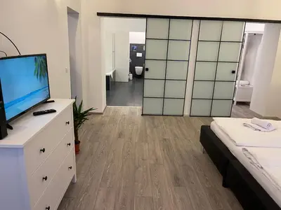 Ein Bett oder Betten in einem Zimmer der Unterkunft Fancy Apartment in the City Center