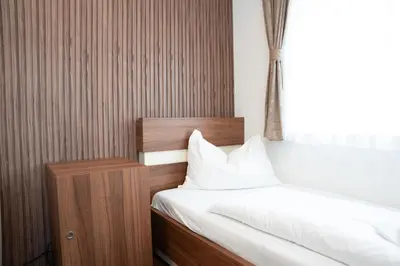 Ein Bett oder Betten in einem Zimmer der Unterkunft Primus Hotel & Apartments