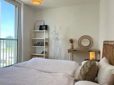 Ein Bett oder Betten in einem Zimmer der Unterkunft Donaublick Oasis: Stylische Wohnung