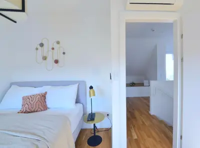 Ein Bett oder Betten in einem Zimmer der Unterkunft The 77 IDA