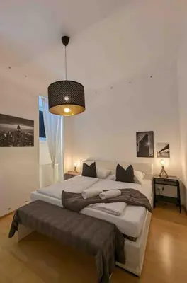 Ein Bett oder Betten in einem Zimmer der Unterkunft Luxury CityApartment 7