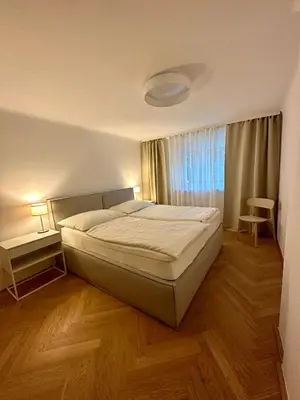 Ein Bett oder Betten in einem Zimmer der Unterkunft Viviane Paulos Apartment - Stylish apartment at Wienerberg