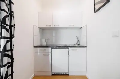 Küche/Küchenzeile in der Unterkunft Modern City Apartment