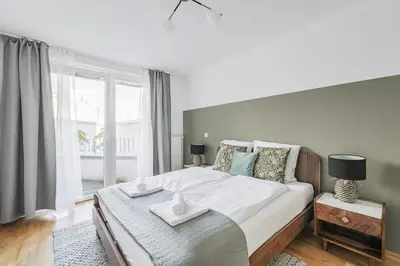 Ein Bett oder Betten in einem Zimmer der Unterkunft Modern Living Apartments Vienna, 15 min to center