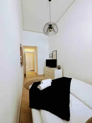 Ein Bett oder Betten in einem Zimmer der Unterkunft Luxury CityApartment 2