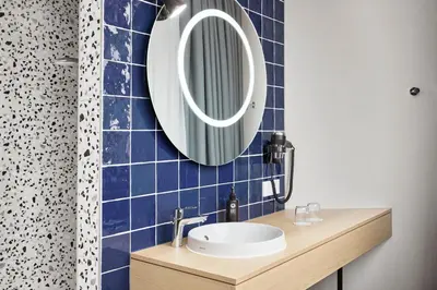 Ein Badezimmer in der Unterkunft H2 Hotel Wien Schönbrunn