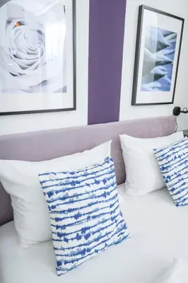 Ein Bett oder Betten in einem Zimmer der Unterkunft Central City Apartments