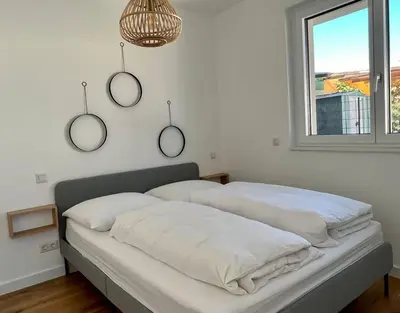 Ein Bett oder Betten in einem Zimmer der Unterkunft Modern Studio Gardenia_Gartenwohnung Alte Donau
