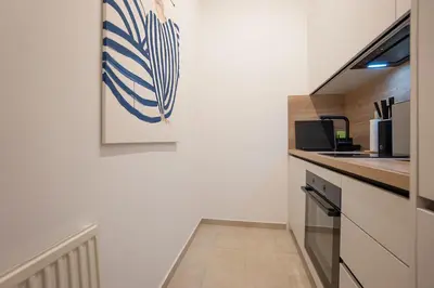 Küche/Küchenzeile in der Unterkunft Stylish central 1-bedroom apartment with a terrace