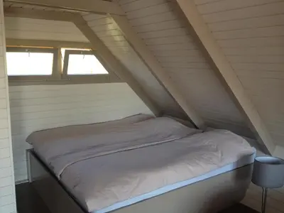 Ein Bett oder Betten in einem Zimmer der Unterkunft Seehütte Neusiedlersee - Pfahlbau GlamPing