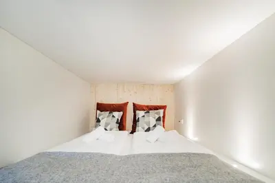 Ein Bett oder Betten in einem Zimmer der Unterkunft CUBES by Tegetthoff