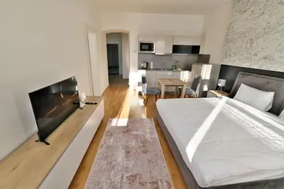 Ein Bett oder Betten in einem Zimmer der Unterkunft Vienna Lotus Apartments