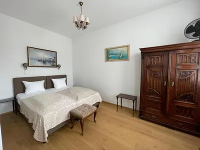 Ein Bett oder Betten in einem Zimmer der Unterkunft Villa Musik - historical apartments, Baden