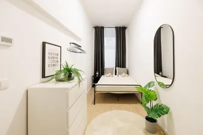 Ein Bett oder Betten in einem Zimmer der Unterkunft Central City Style Rooms by Home2