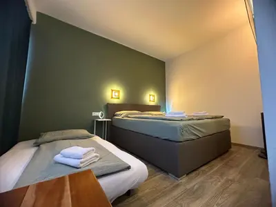 Ein Bett oder Betten in einem Zimmer der Unterkunft bookVienna 