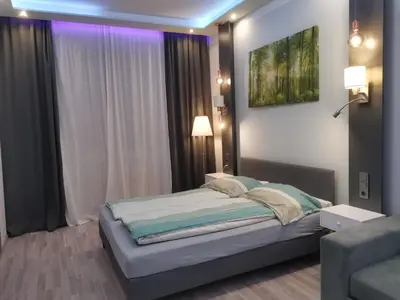 Ein Bett oder Betten in einem Zimmer der Unterkunft Elegance Suiten Wien
