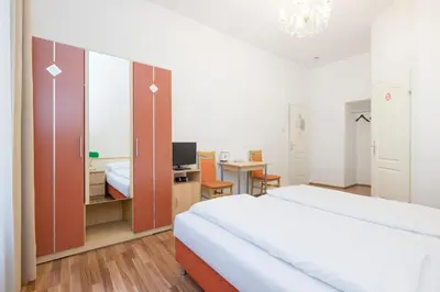Ein Bett oder Betten in einem Zimmer der Unterkunft Pension Votiv