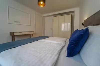 Ein Bett oder Betten in einem Zimmer der Unterkunft BelVie Residence