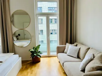 Ein Sitzbereich in der Unterkunft Zentrales Apartment mit Balkon