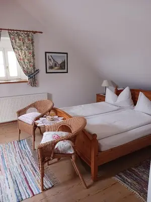 Ein Bett oder Betten in einem Zimmer der Unterkunft Gästehaus Hans Moser