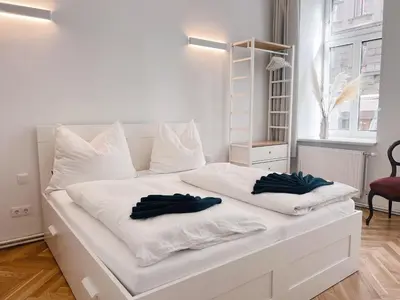 Ein Bett oder Betten in einem Zimmer der Unterkunft Central Loft Apartment near Belvedere Castle