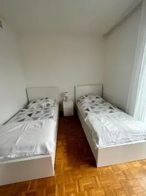 Ein Bett oder Betten in einem Zimmer der Unterkunft Neugebäudestrasse