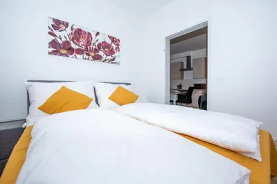 Ein Bett oder Betten in einem Zimmer der Unterkunft Lipi Apartment