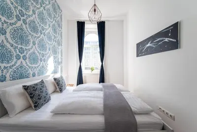 Ein Bett oder Betten in einem Zimmer der Unterkunft Spacious 2BR by Metro and Center by HM