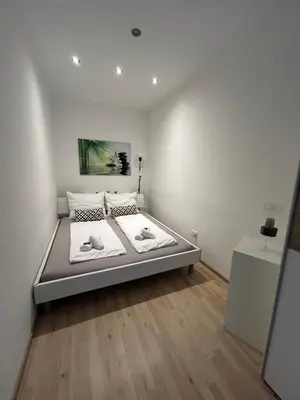 Ein Bett oder Betten in einem Zimmer der Unterkunft Vienna City Apartment - Stadthalle