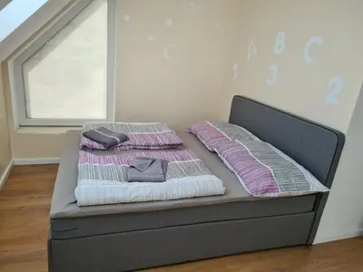 Ein Bett oder Betten in einem Zimmer der Unterkunft GardenLoft no 6