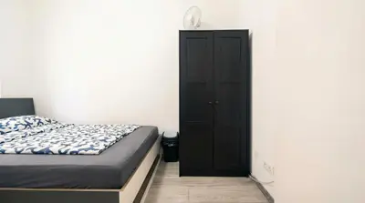 Ein Bett oder Betten in einem Zimmer der Unterkunft 15 Min to Vienna Center - Affordable & Simple 5BR Apt with WIFI