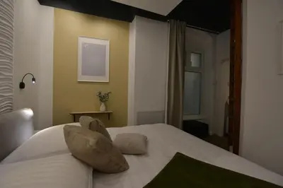 Ein Bett oder Betten in einem Zimmer der Unterkunft MeetsLeopold