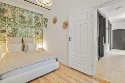 Ein Bett oder Betten in einem Zimmer der Unterkunft Apartment Botanika