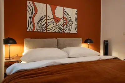 Ein Bett oder Betten in einem Zimmer der Unterkunft Bright, modern and central flat with a terrace