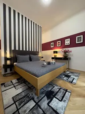 Ein Bett oder Betten in einem Zimmer der Unterkunft Classy Suite Museumsquartier