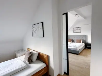 Ein Bett oder Betten in einem Zimmer der Unterkunft Up Residences S