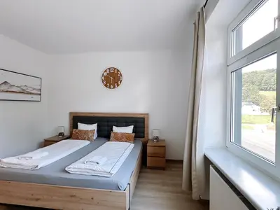 Ein Bett oder Betten in einem Zimmer der Unterkunft Up Resistances G