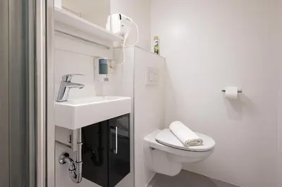 Ein Badezimmer in der Unterkunft DAINN Apartments Schönbrunn