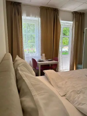 Ein Bett oder Betten in einem Zimmer der Unterkunft Apartment mit Gartenblick und Terrasse