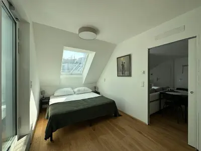 Ein Bett oder Betten in einem Zimmer der Unterkunft FeelHome-Dachterrasse-4 Gäste-WiFi