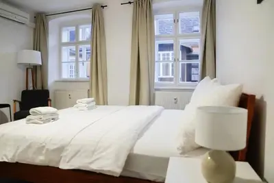 Ein Bett oder Betten in einem Zimmer der Unterkunft Authentic Austrian Flat in the South of Vienna