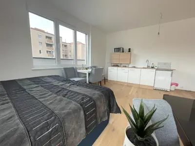 Ein Bett oder Betten in einem Zimmer der Unterkunft Green Garden Apartments