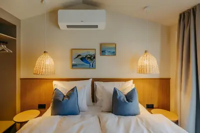 Ein Bett oder Betten in einem Zimmer der Unterkunft Neueröffnung NEUER STRAND inklusive Burgenland Card