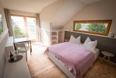 Ein Bett oder Betten in einem Zimmer der Unterkunft SCHEIBER Wein & Gästehaus