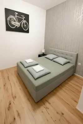 Ein Bett oder Betten in einem Zimmer der Unterkunft City Flat C