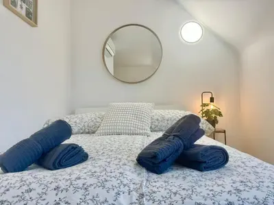 Ein Bett oder Betten in einem Zimmer der Unterkunft City Suites of BLE