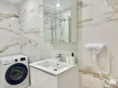 Ein Badezimmer in der Unterkunft City Suites of BLE